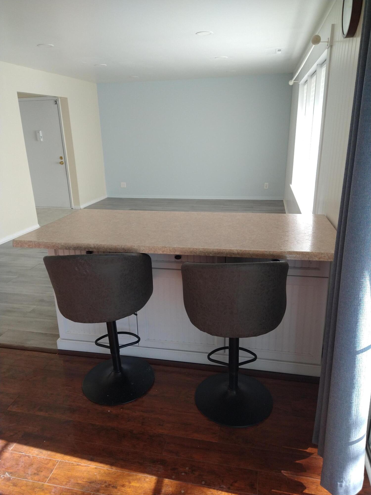 20245 Independence Drive, Unit B Brookfield, WI 53045 - Photo 5 of 23 eat in counter view to living room indpe