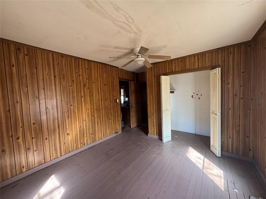 610 5th Street Hawley, TX 79525 - Photo 11 of 19 a view of a hallway with wooden floor