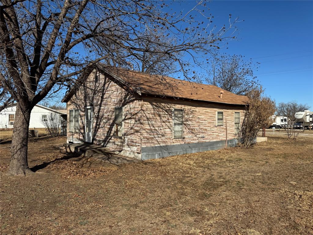 610 5th Street Hawley, TX 79525 - Photo 18 of 19 a view of a yard with a tree
