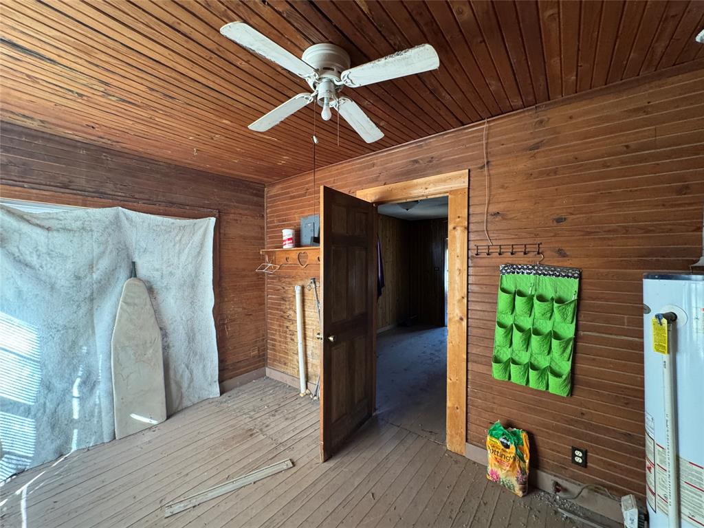 610 5th Street Hawley, TX 79525 - Photo 9 of 19 a view of a hallway with wooden floor and staircase