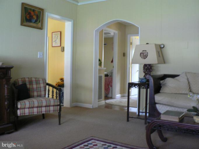 7423 Station Road Newcomb, MD 21653 - Photo 2 of 17 a living room with furniture and a window