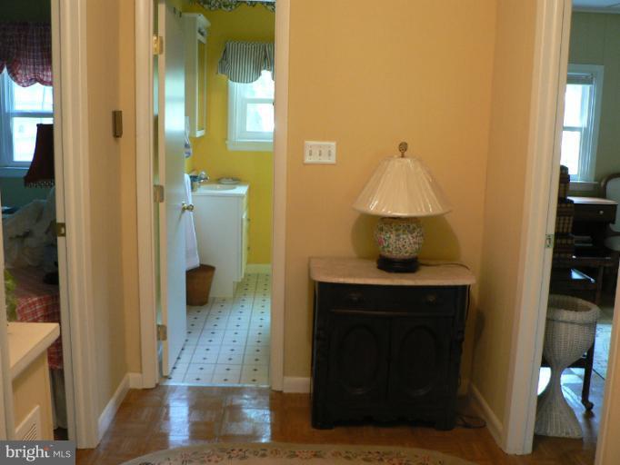 7423 Station Road Newcomb, MD 21653 - Photo 5 of 17 a bathroom with a sink and a mirror