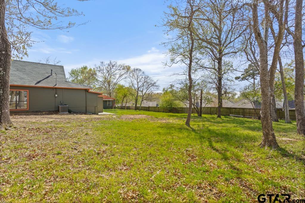 2819 New Copeland Road Tyler, TX 75701 - Photo 29 of 39 a view of an house with backyard space and garden