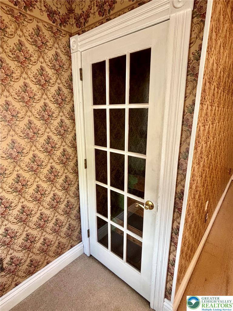 7241 Decatur Street New Tripoli, PA 18066 - Photo 25 of 36 A classic French door with elegant trim invites entry into the attic.