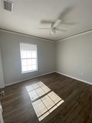 a view of a room with wooden floor and stairs
