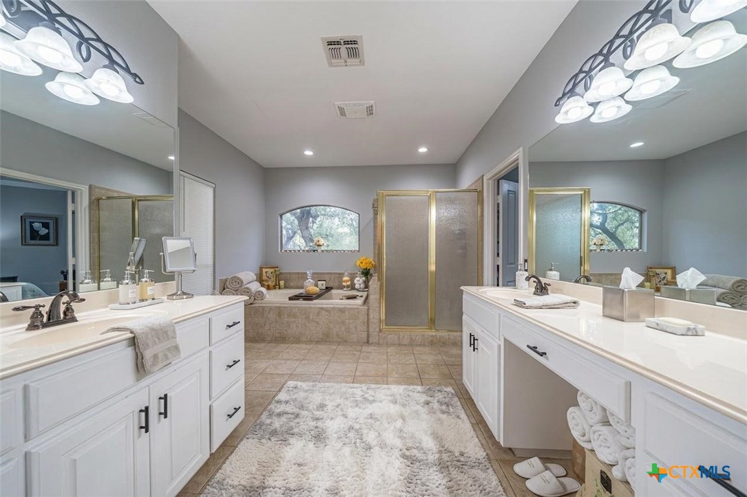 519 Long Meadow Spring Branch, TX 78070 - Photo 17 of 33 a large bathroom with a double vanity sink mirror and double