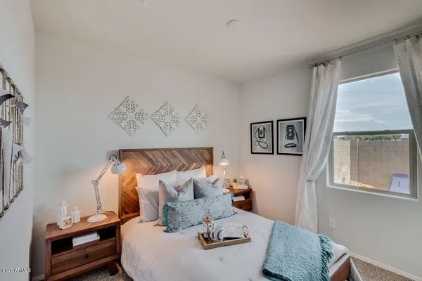 a bed room with a bed and a window