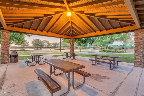 a view of a chairs and table in the patio