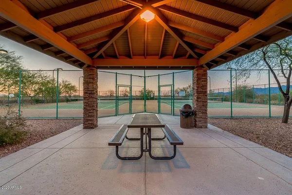 a view of a backyard with sitting area
