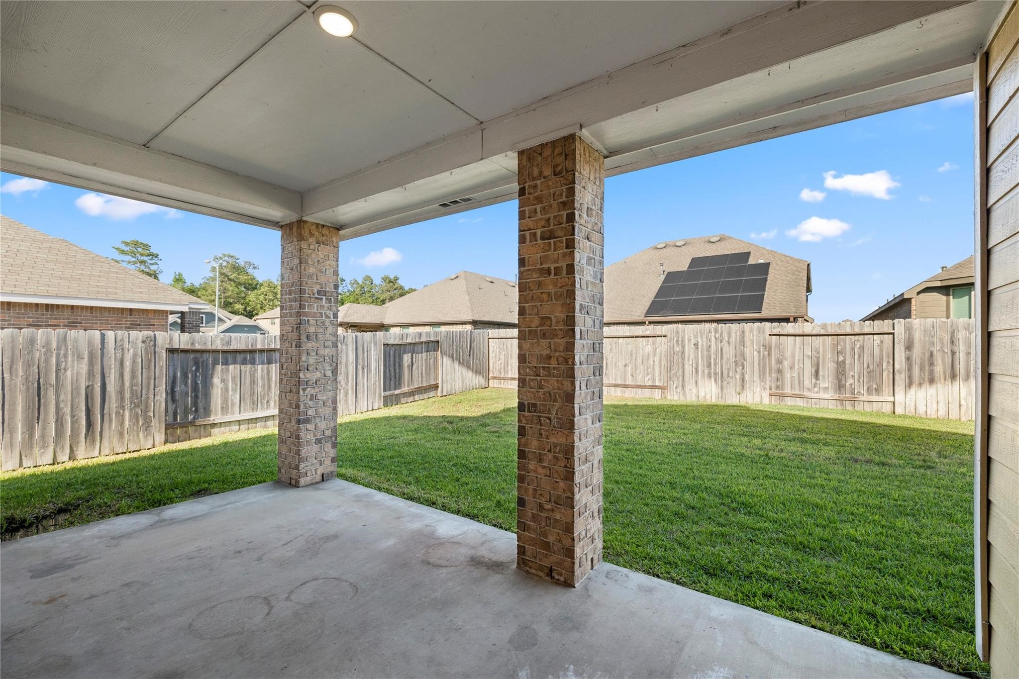 29507 Whitebrush Trace Drive Spring, TX 77386 - Photo 3 of 32 Covered back patio overlooking the fenced backyard.