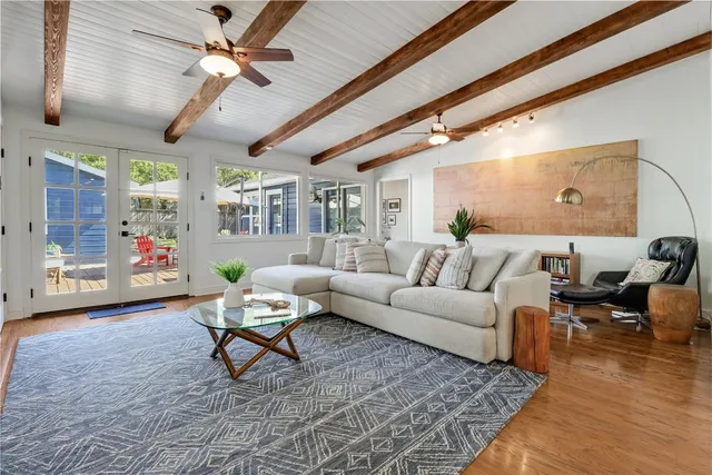 a living room with furniture and a rug