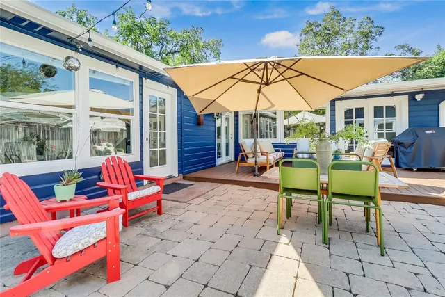 a outdoor space with lots of chairs and umbrellas