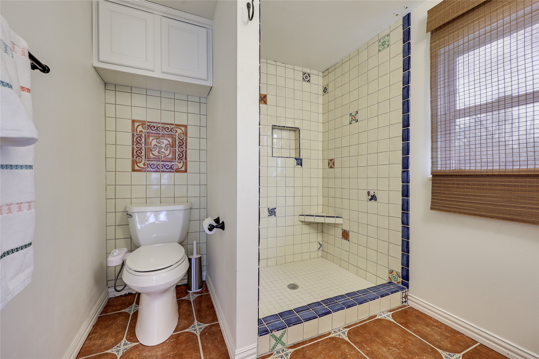 2908 Perry Lane Austin, TX 78731 - Photo 35 of 37 a bathroom with a toilet and a shower