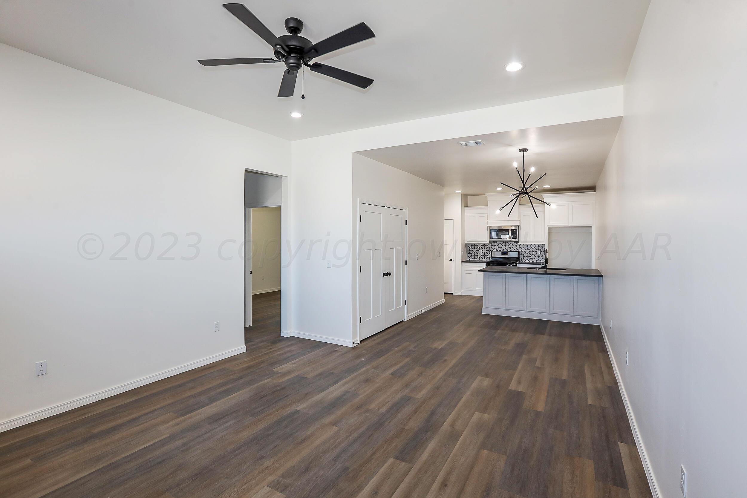 13771 Periwinkle Drive Amarillo, TX 79119 - Photo 23 of 23 a view of a kitchen with a sink and wooden floor