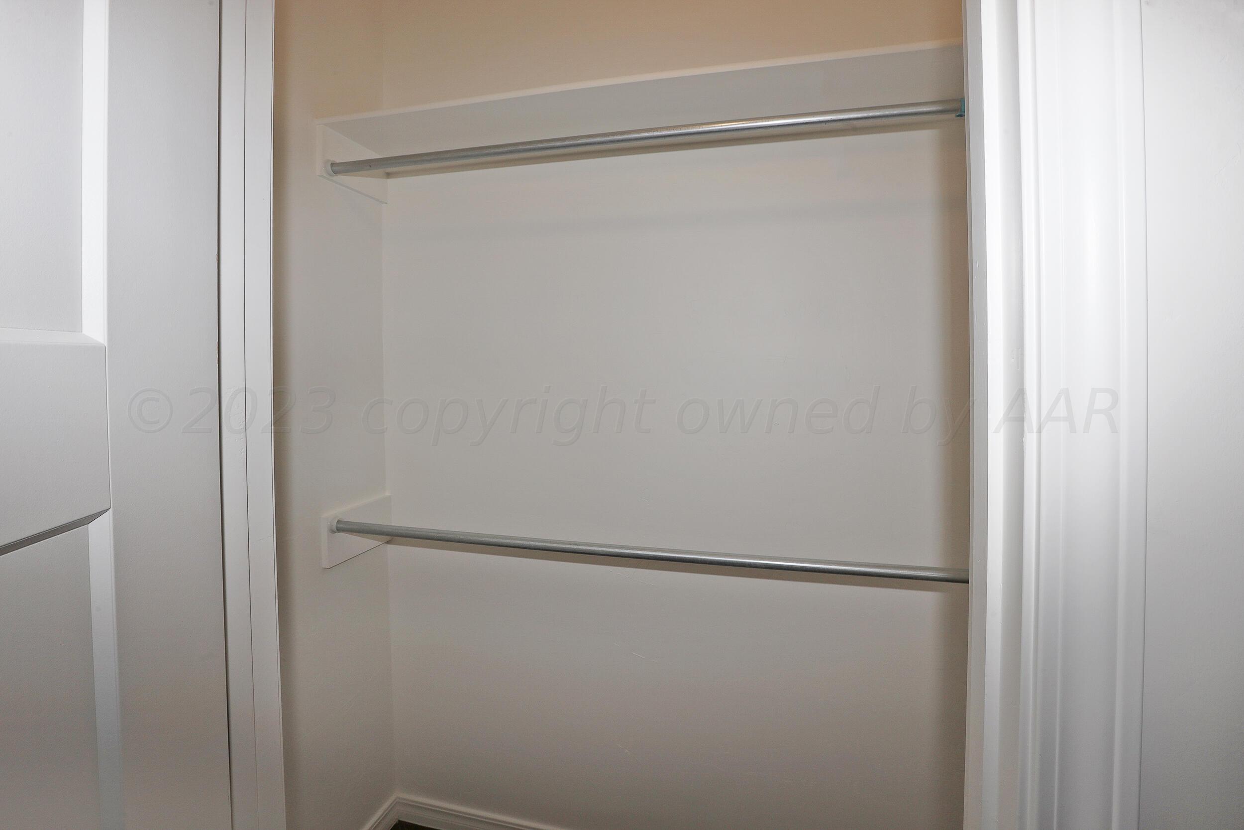 13771 Periwinkle Drive Amarillo, TX 79119 - Photo 14 of 23 a bathroom with a glass shower door