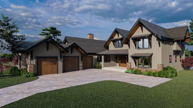 a front view of a house with a yard and trees