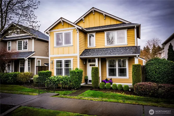 a front view of a house with garden