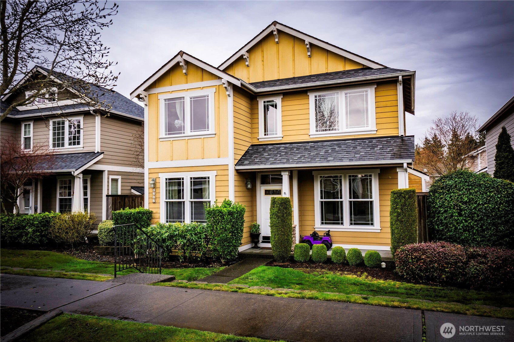a front view of a house with garden