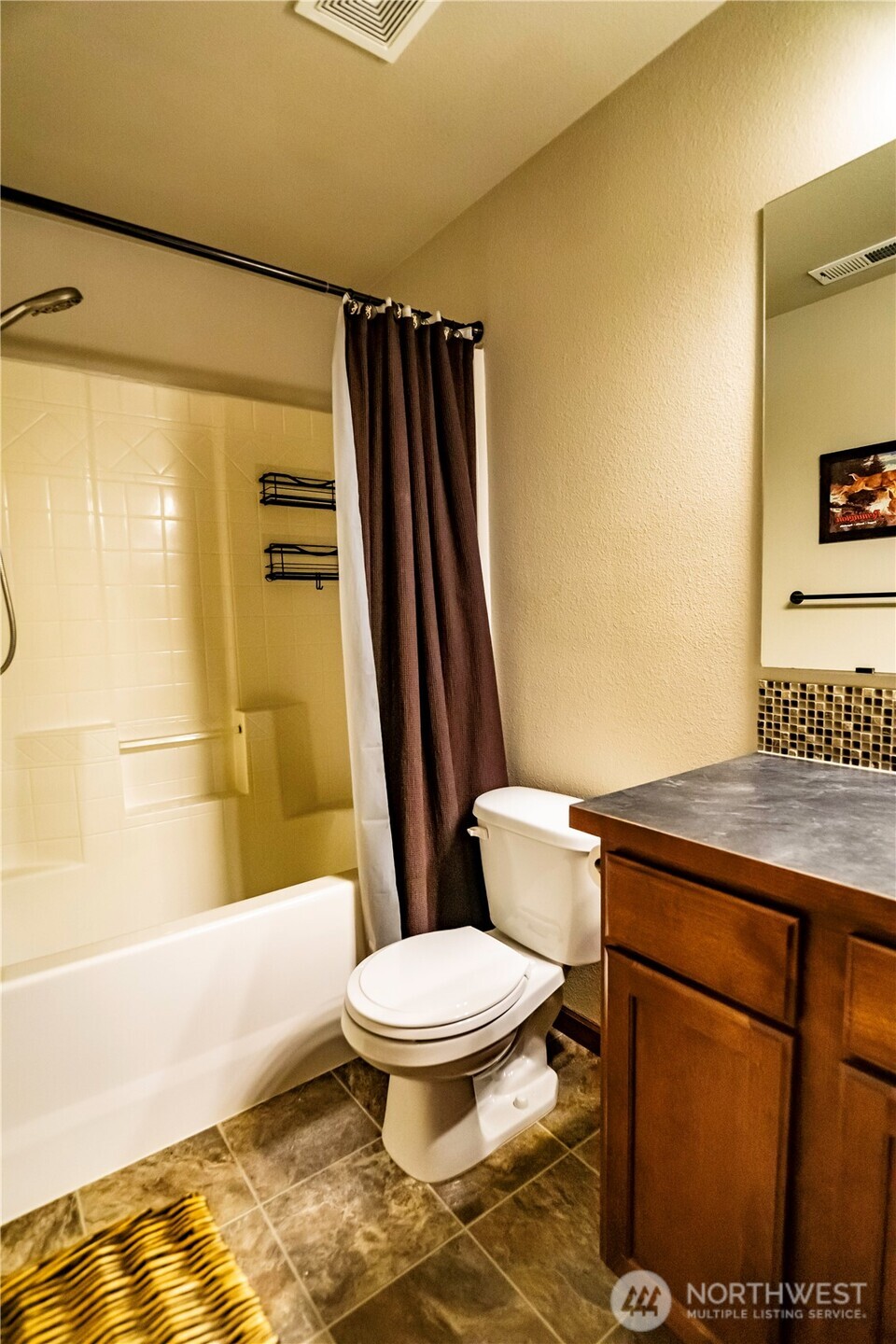 4646 Rochelle Street Southeast Lacey, WA 98503 - Photo 19 of 31 a bathroom with a sink toilet and shower