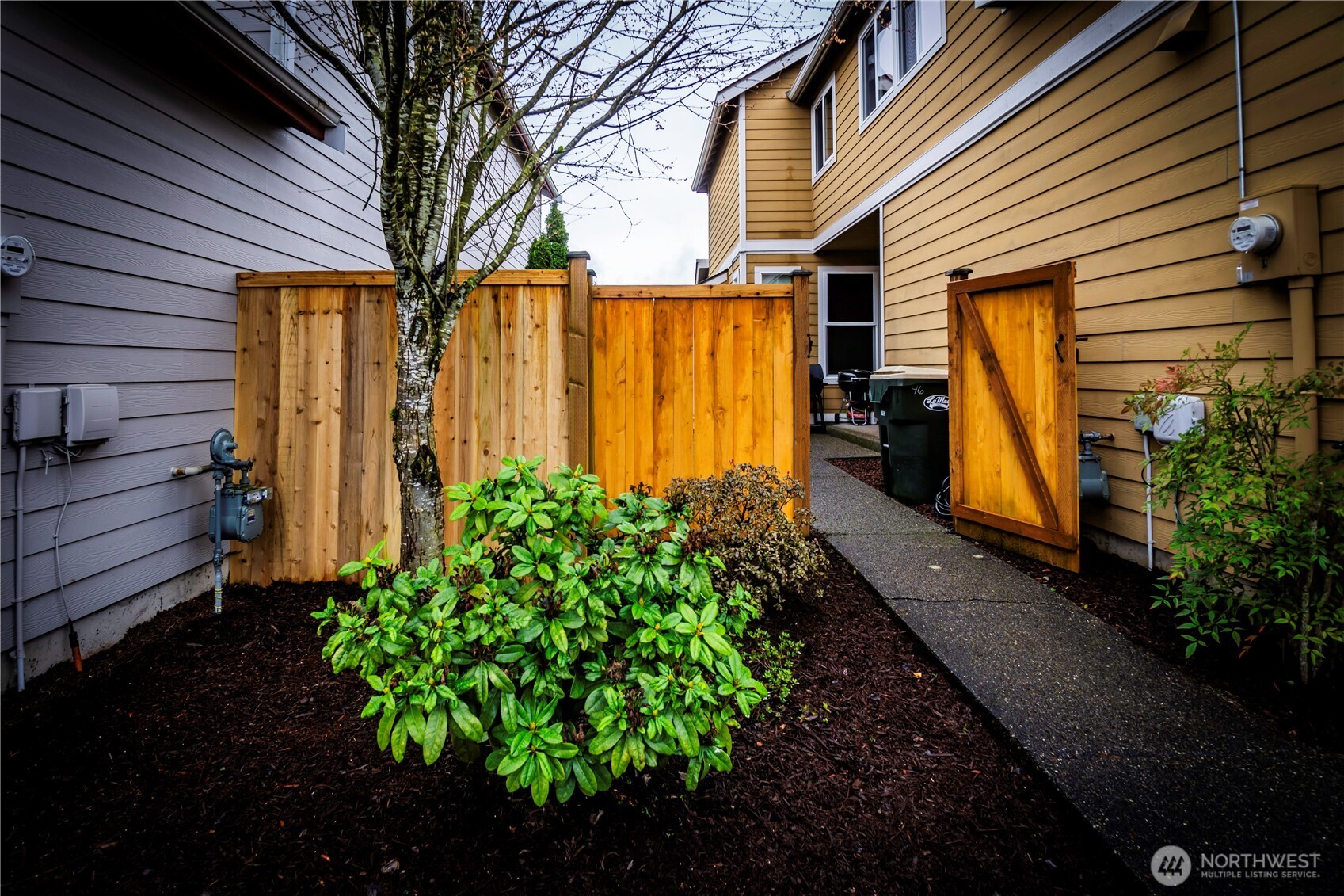 4646 Rochelle Street Southeast Lacey, WA 98503 - Photo 26 of 31 a front view of a house with garden
