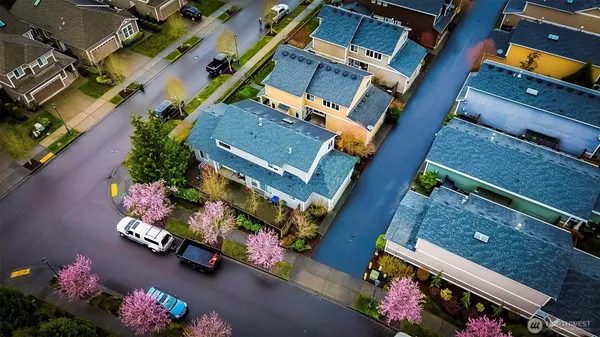 a view of a house with a backyard
