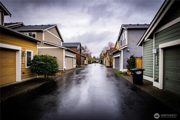 an aerial view of a houses with yard