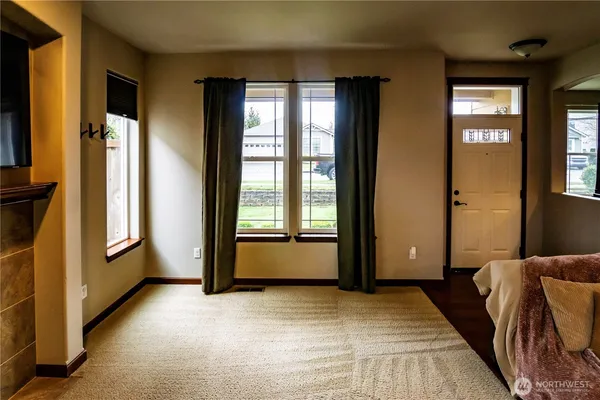 a view of livingroom with furniture and window