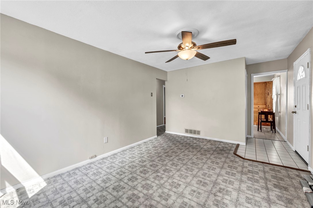5038 Forest Road Mentor, OH 44060 - Photo 5 of 29 Tiled spare room with ceiling fan