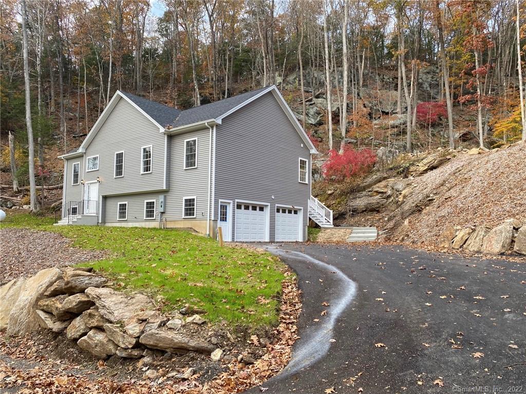 38 Little Punkup Road Oxford, CT 06478 - Photo 1 of 1 a view of a house with a yard and potted plants
