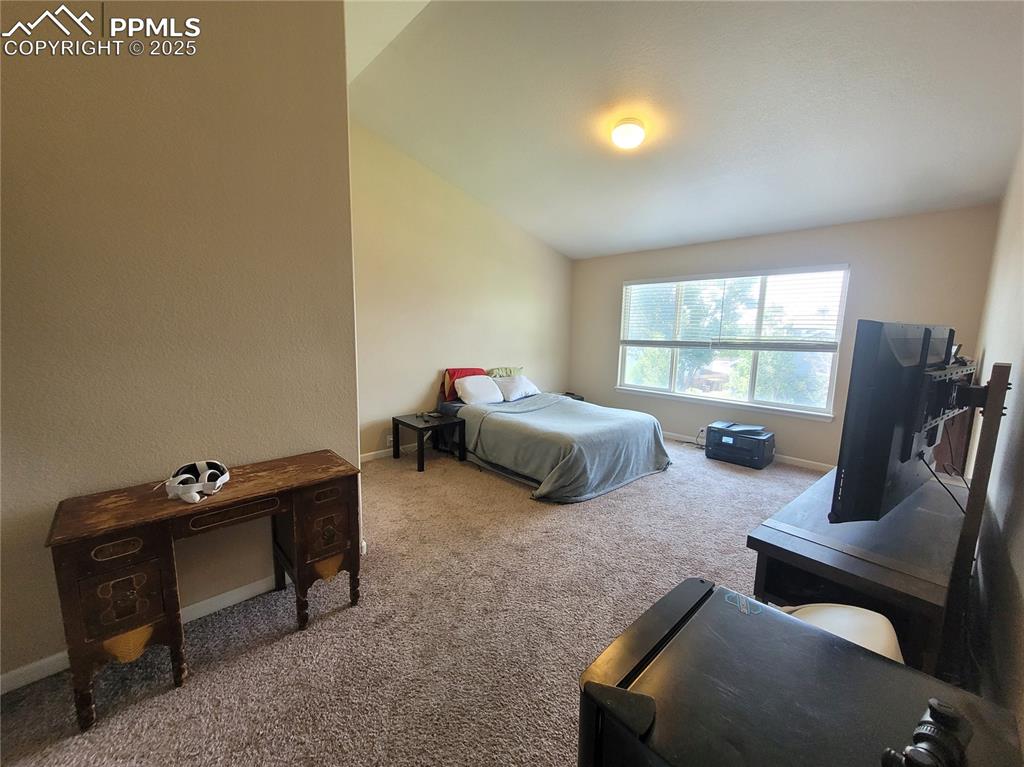 8975 Kingston Heath Road Peyton, CO 80831 - Photo 11 of 18 a bedroom with furniture and a window