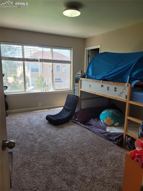 8975 Kingston Heath Road Peyton, CO 80831 - Photo 6 of 18 a room with furniture and a window