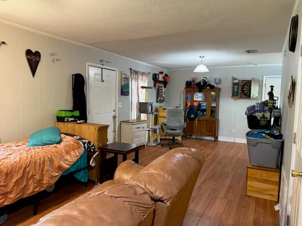 a bedroom with bed and a window