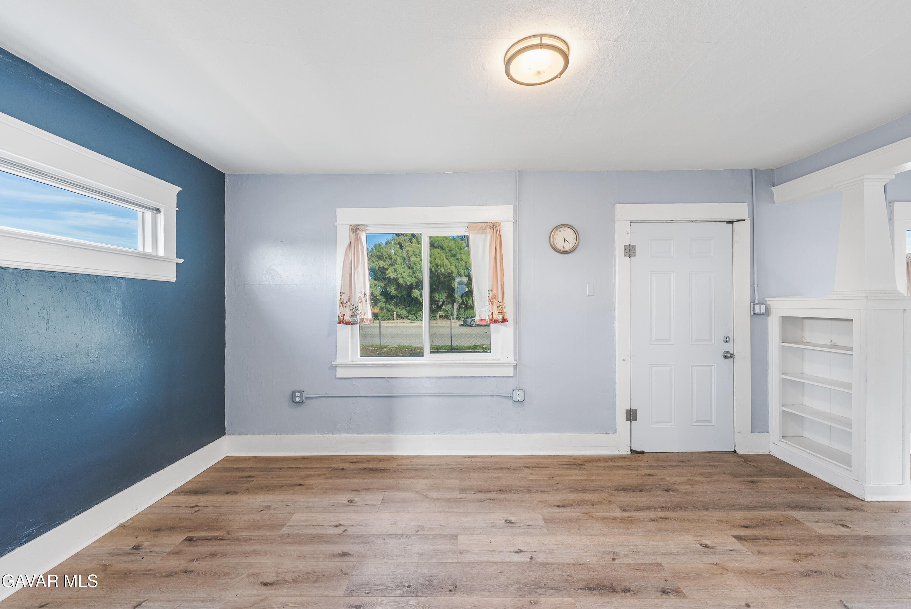 15733 K Street Mojave, CA 93501 - Photo 13 of 38 wooden floor in an empty room with a window