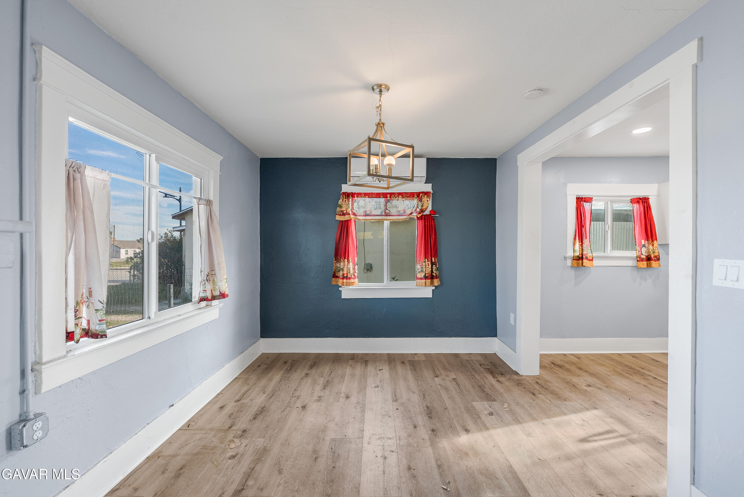 15733 K Street Mojave, CA 93501 - Photo 14 of 38 wooden floor in an empty room with a window