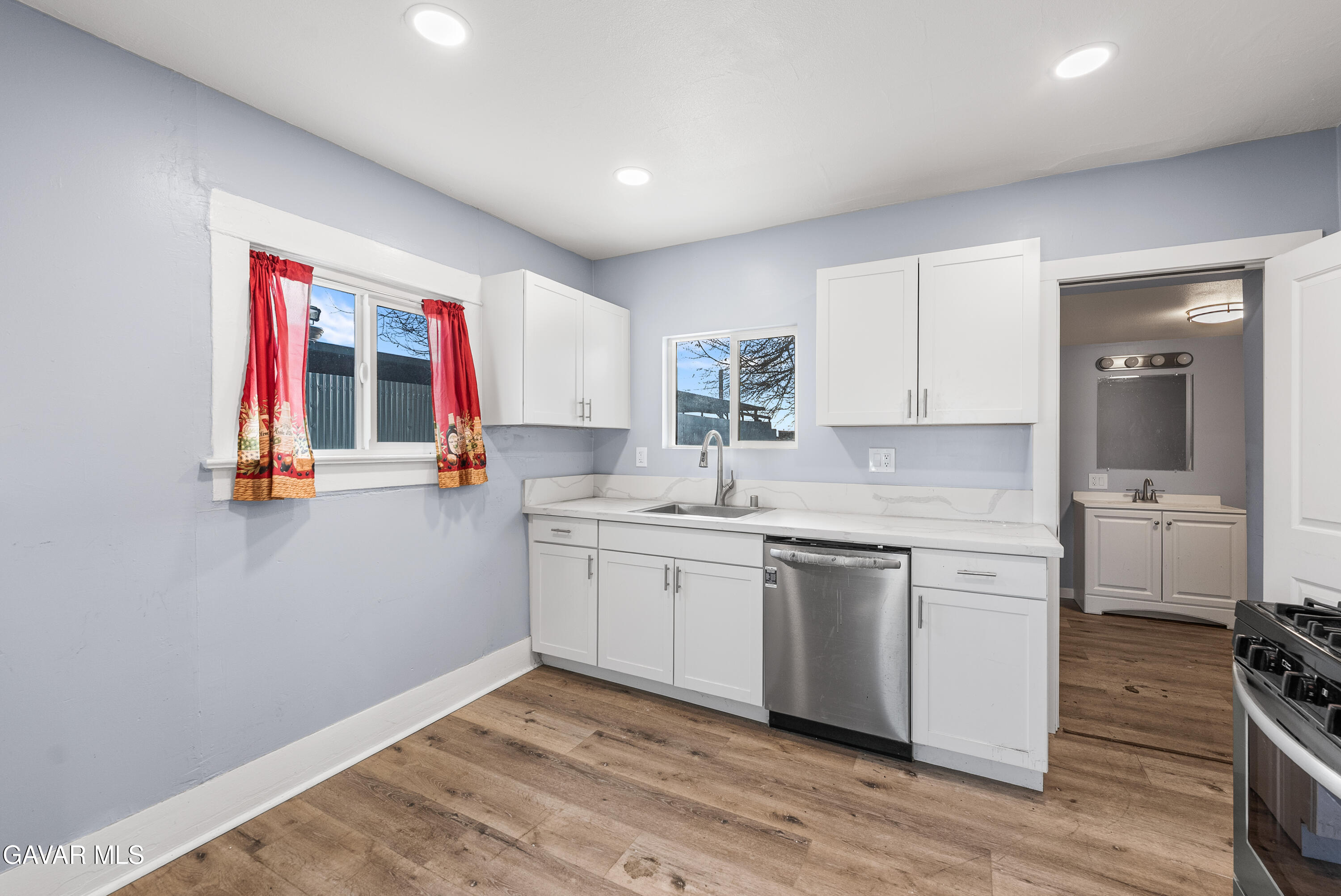15733 K Street Mojave, CA 93501 - Photo 20 of 38 a kitchen with a sink cabinets and window