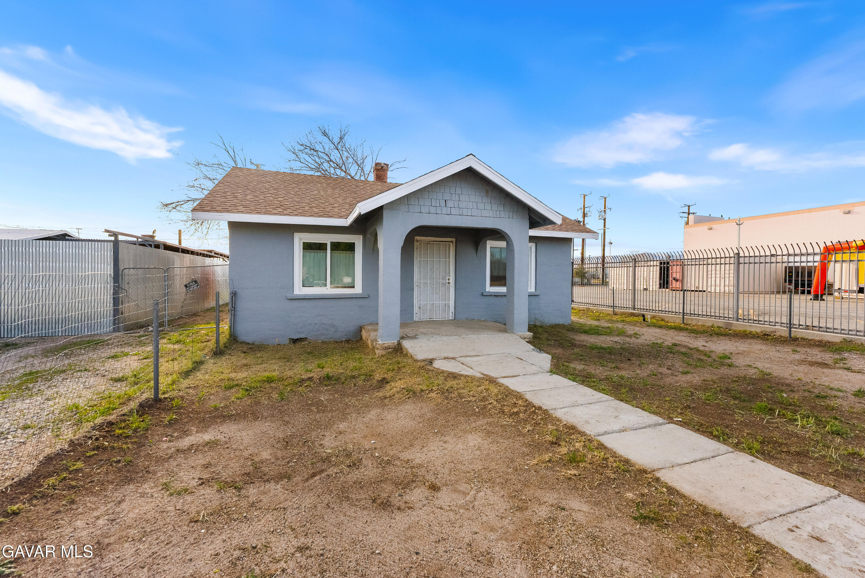 15733 K Street Mojave, CA 93501 - Photo 2 of 38 a backyard of a house with a garage