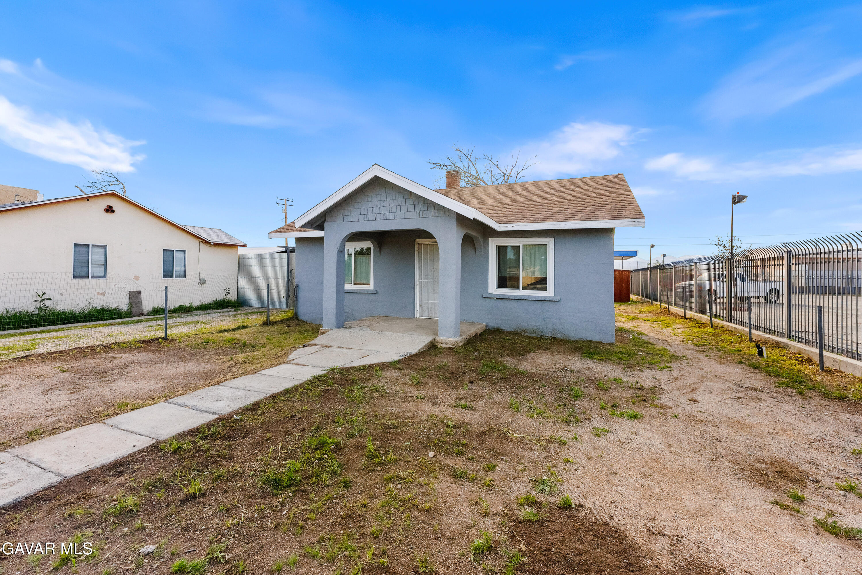15733 K Street Mojave, CA 93501 - Photo 3 of 38 a view of a house with a yard