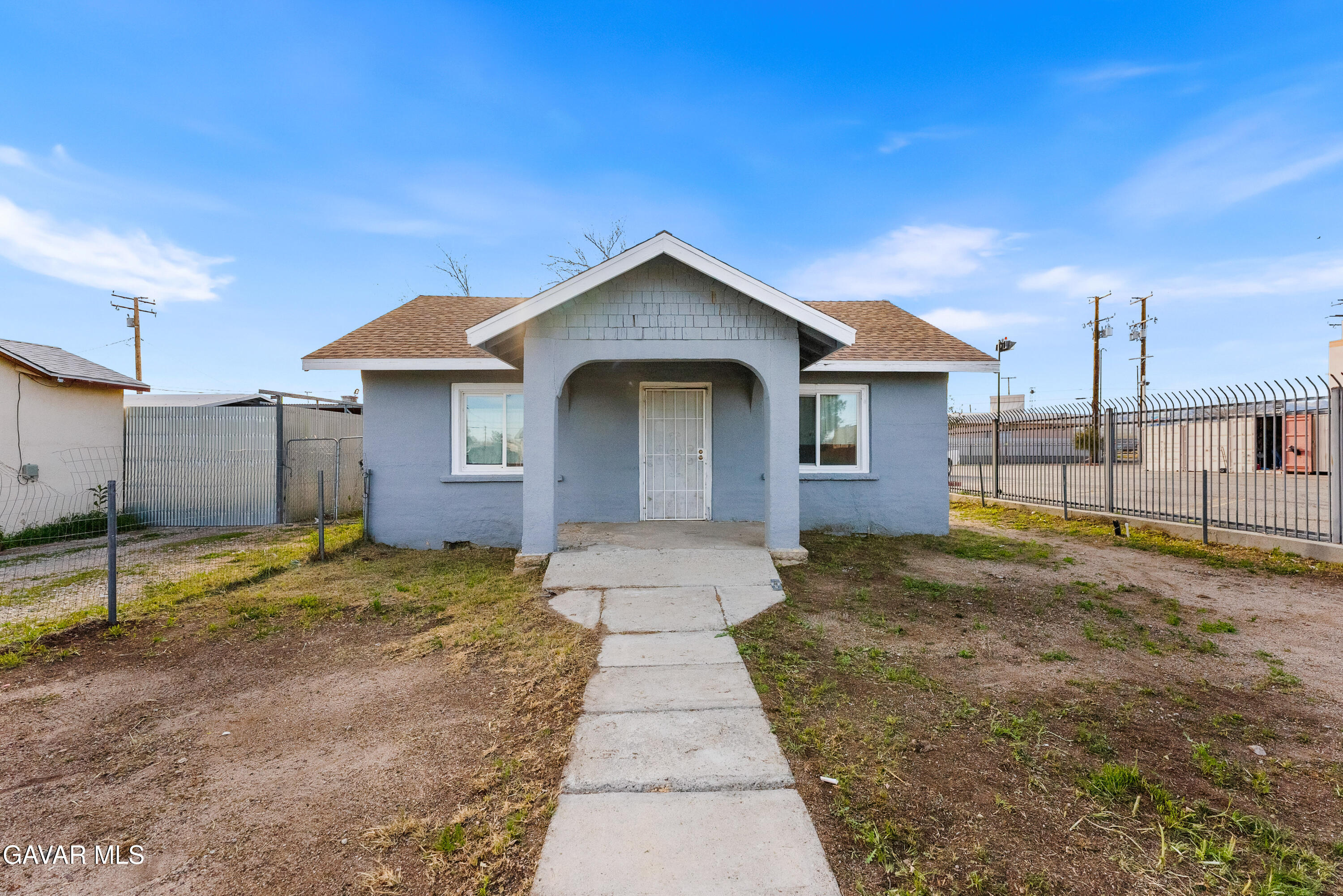 15733 K Street Mojave, CA 93501 - Photo 4 of 38 a view of a house with a yard