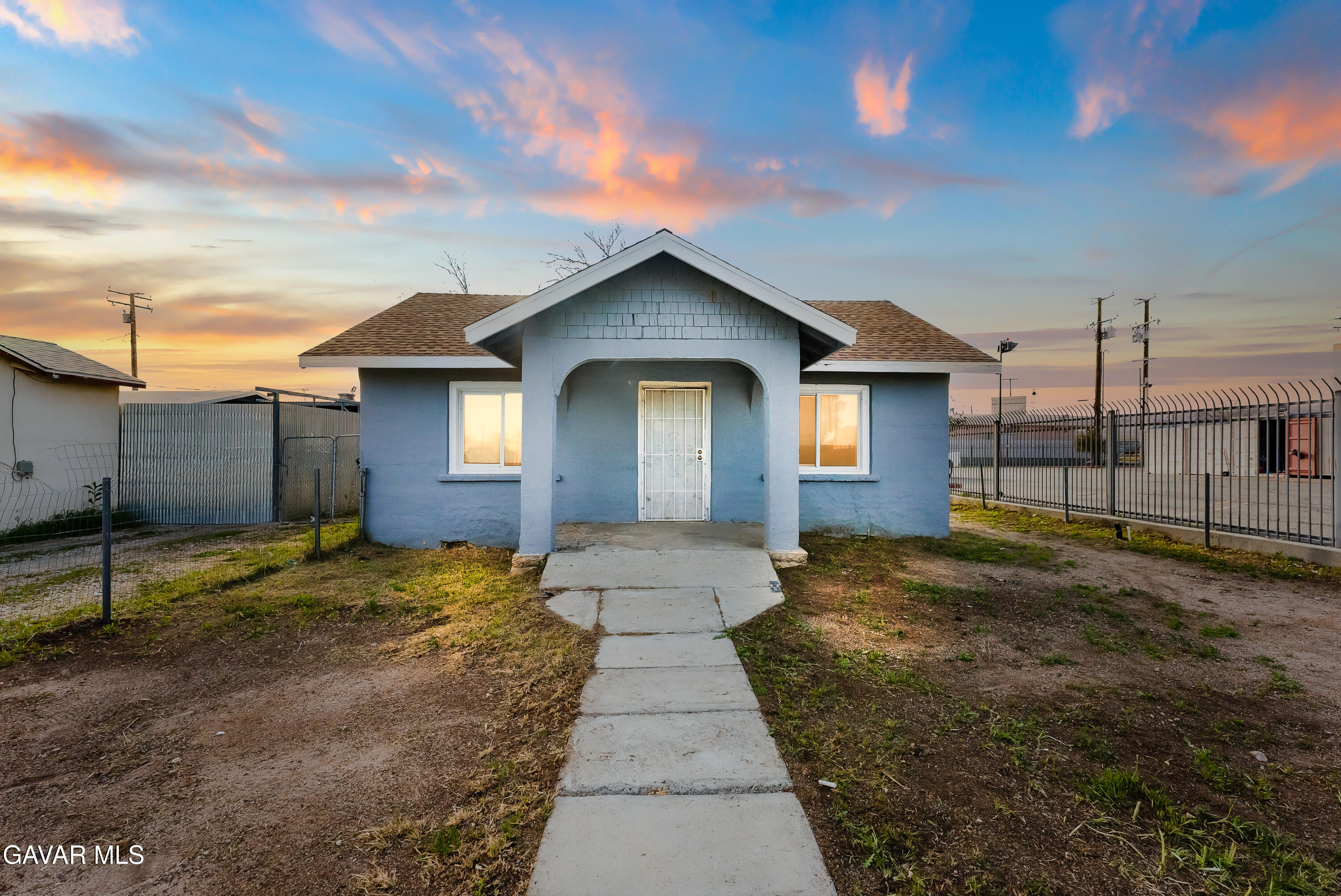 15733 K Street Mojave, CA 93501 - Photo 5 of 38 a view of a house with a yard