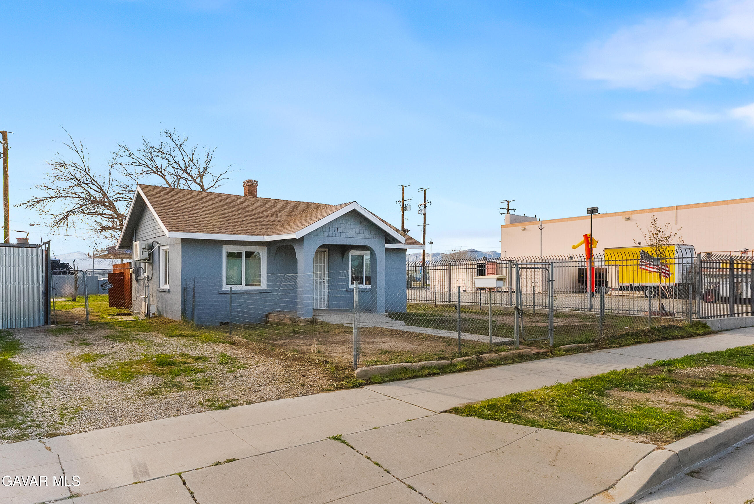 15733 K Street Mojave, CA 93501 - Photo 6 of 38 a view of a house with a yard