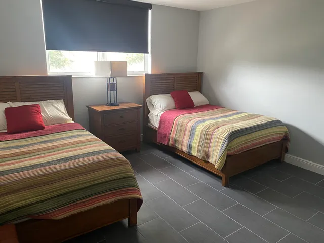 a bedroom with a bed and window