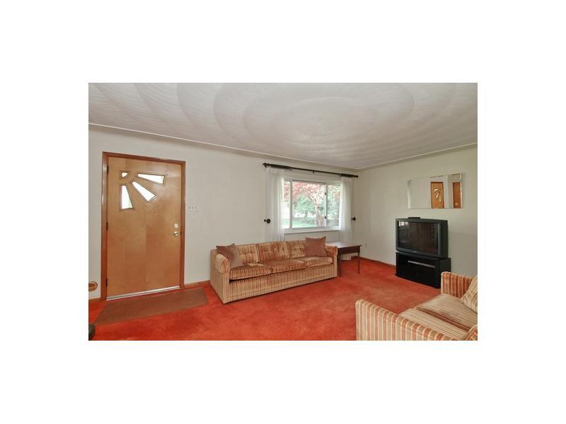 266 East Union Road Cheswick, PA 15024 - Photo 6 of 10 Living Room. Hardwood floors under carpet,plaster walls,picture window