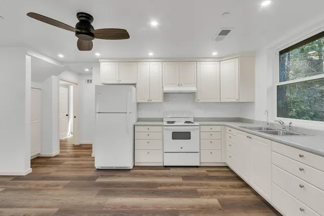 a view of a kitchen with electric appliances