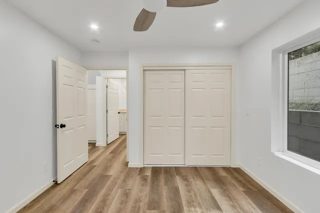 a kitchen with white cabinets and a stove
