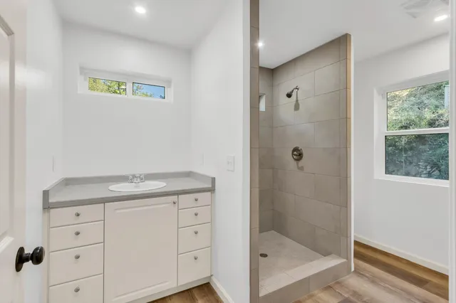 a view of a balcony with wooden floor and wooden fence