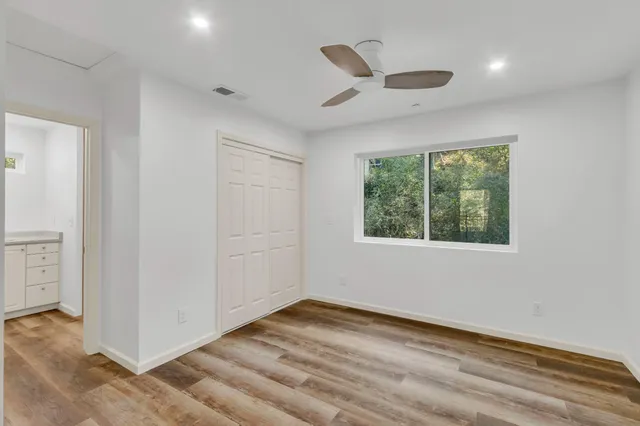 a view of a yard with a tree