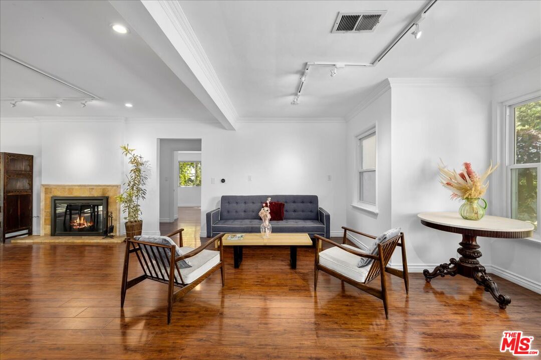 6867 Apperson Street Tujunga, CA 91042 - Photo 11 of 54 a living room with furniture and a fireplace