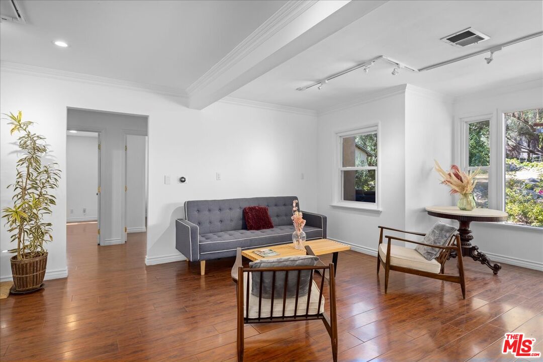 6867 Apperson Street Tujunga, CA 91042 - Photo 12 of 54 a living room with furniture and a wooden floor