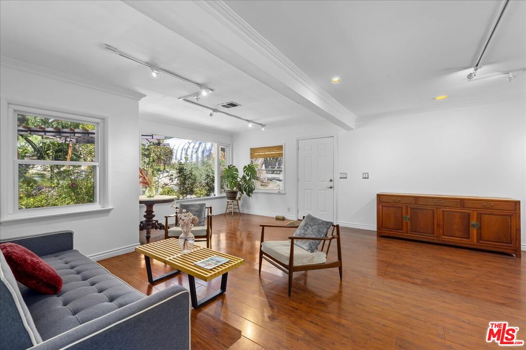 6867 Apperson Street Tujunga, CA 91042 - Photo 14 of 54 a living room with furniture and a window