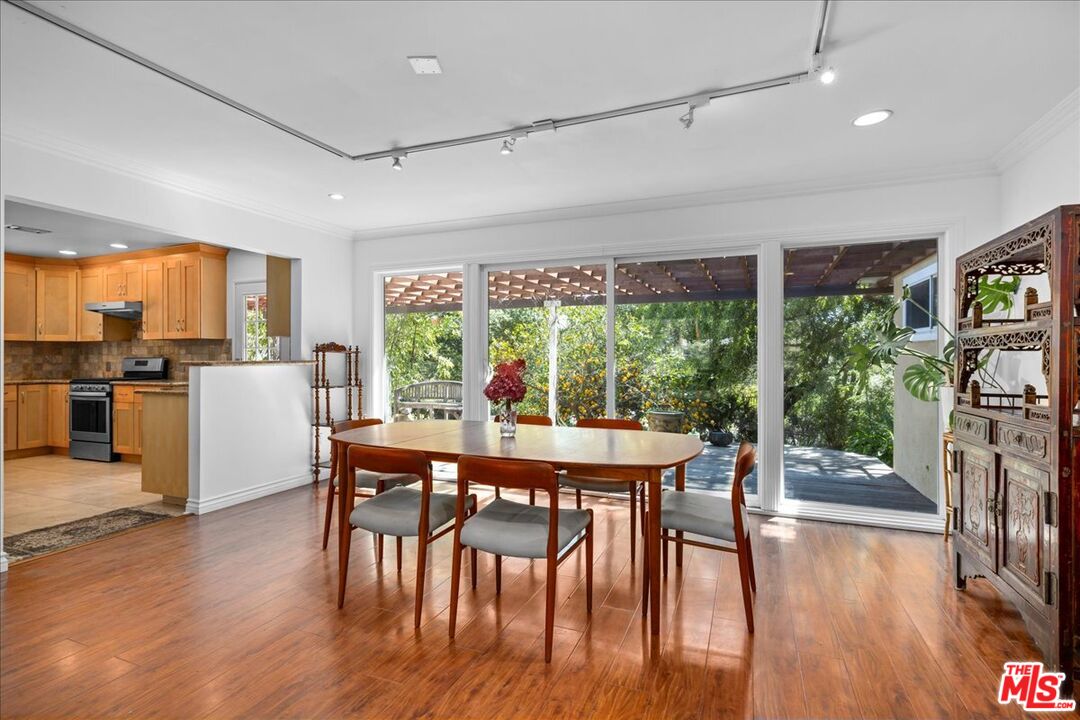6867 Apperson Street Tujunga, CA 91042 - Photo 15 of 54 a view of a dining room with furniture window and wooden floor